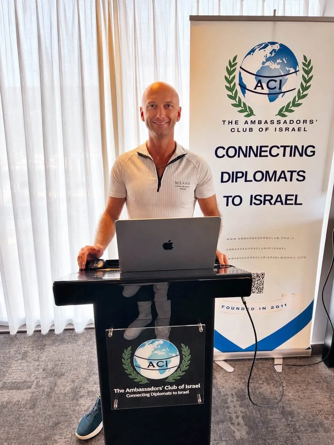 Alex Kap speaking at the Ambassadors Club of Israel