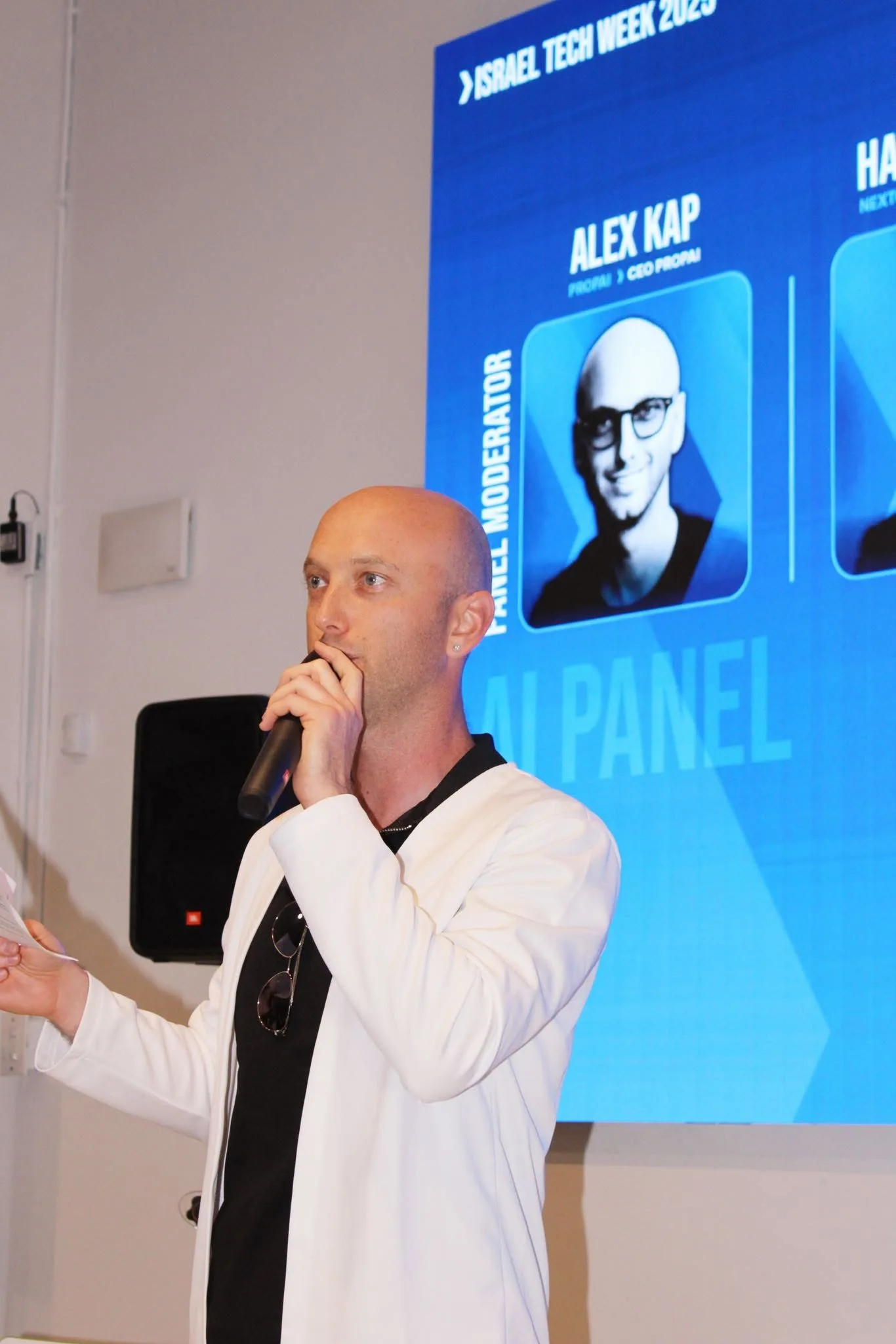 Alex Kap moderating an AI panel at Israel Tech Week